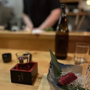 Sake and sashimi at the bar.