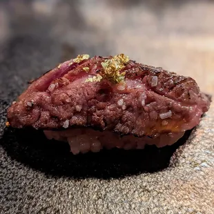 a piece of raw meat on a rock