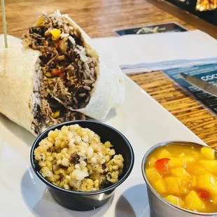 Luau Pork Burrito with bacon couscous and mango salsa