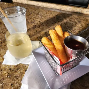 a basket of fries and a glass of lemonade