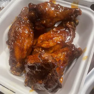 chicken wings in a styrofoam container