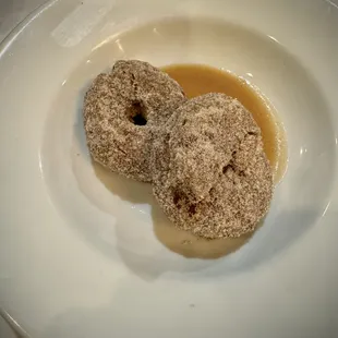 Apple cider doughnuts rolled in cinnamon and sugar, served warm! Yum!!