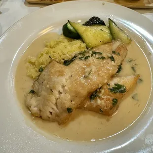 Rock fish with a white wine cream sauce, rice and veggies!