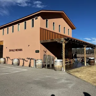a winery building with barrels