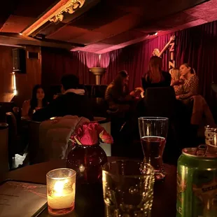 people sitting in a dimly lit room