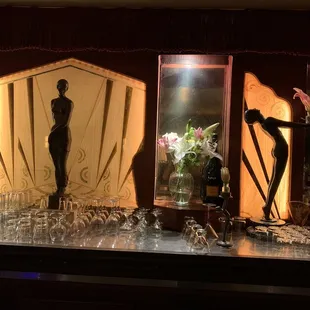 a man in a tuxedo and wine glasses