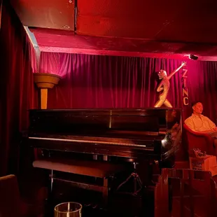 a man sitting on a piano