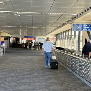 a man with a suitcase at an airport