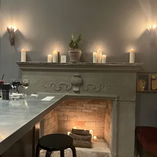 a fireplace with candles on it