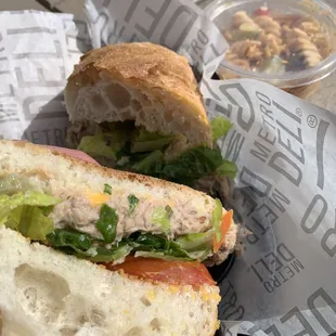 Tuna sandwich with pasta salad.