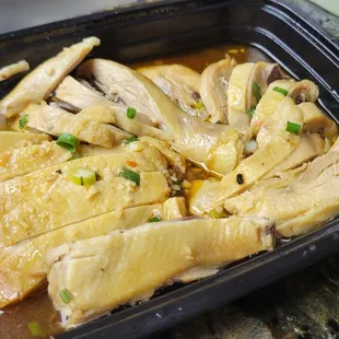 a chicken dish in a plastic container