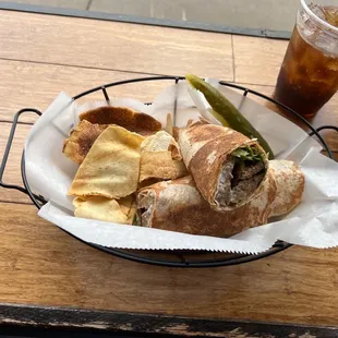 Here is a gyro served more as a wrap that is slightly toasted. Great flavor all the way around! Wrap, meat, and sauce.   A winner!