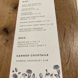 a menu on a wooden table