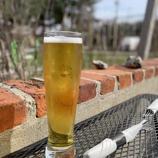 a glass of beer on a table
