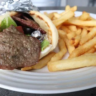 a steak sandwich and french fries
