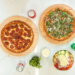 two pizzas and a salad