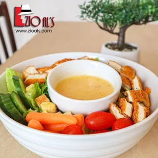 a bowl of chicken and vegetables