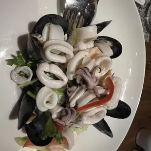a plate of seafood and squid