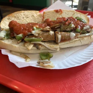 a sandwich on a paper plate