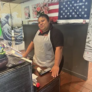 a woman preparing food in a kitchen