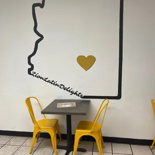 a table and chairs in a restaurant