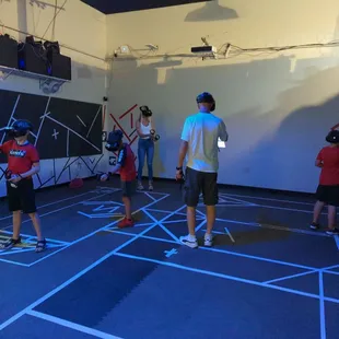 Family playing Alice in Wonderland escape adventure together