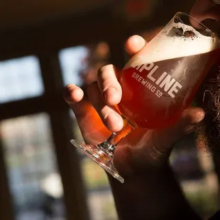 a man drinking a beer