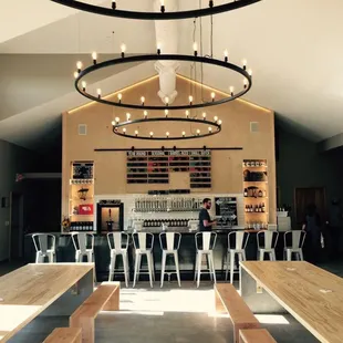 Locally made beer hall chandeliers over community tables