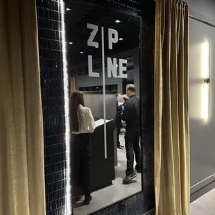 a man and a woman standing at a counter