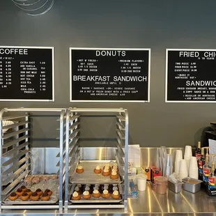 a coffee shop with menus on the wall