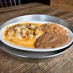Chicken Enchiladas with beans and rice.