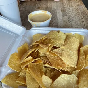 a woman eating chips