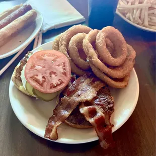 Burger with bacon and onion rings.