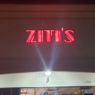 the front of a store at night