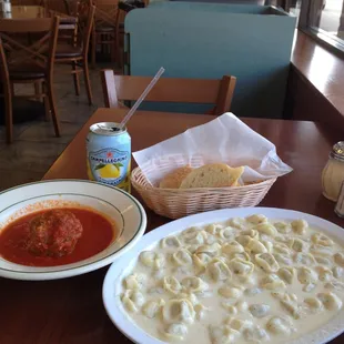 Huge pasta portions worth sharing! This is beef tortellini Alfredo with a meatball on the side.