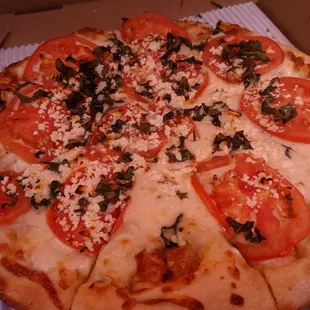 One of their signature pizzas (the Margarita)