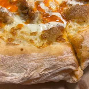 a pizza with meat and cheese