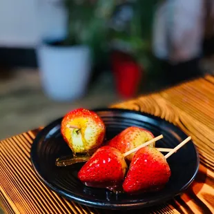 strawberries and apples on a plate