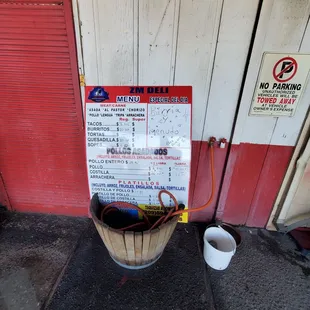 a bucket with a hose attached to it