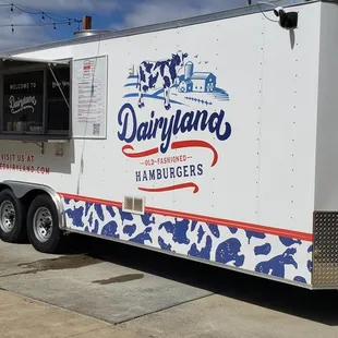 a food truck parked on the side of the road