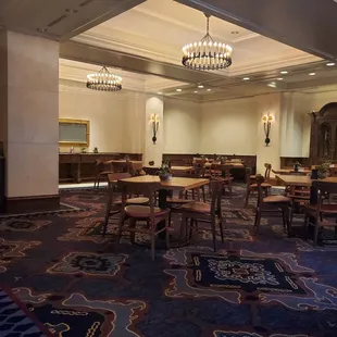 a dining room with tables and chairs