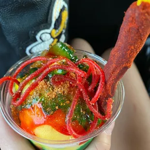a person holding a bowl of food