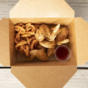 a box of fried chicken and fries