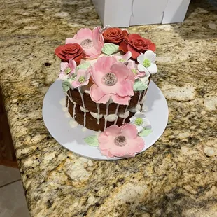 a chocolate cake decorated with flowers