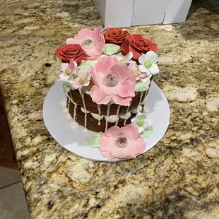 a chocolate cake decorated with flowers