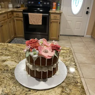 a cake with icing and flowers