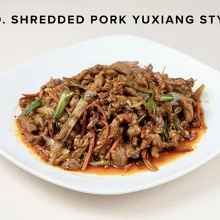a plate of stir fried pork