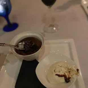 a plate of food and a glass of wine