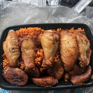 This plate is called the wing combo ( wings plantains and jollof rice) which i bought on Tuesday 3/26/24