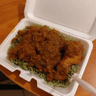 a styrofoam takeout box filled with food